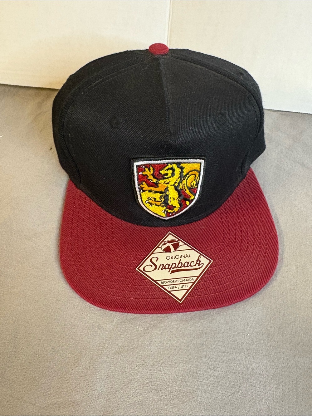 Harry Potter Grtffindor Black and Burgundy Snapback Hat with Heraldic Crest